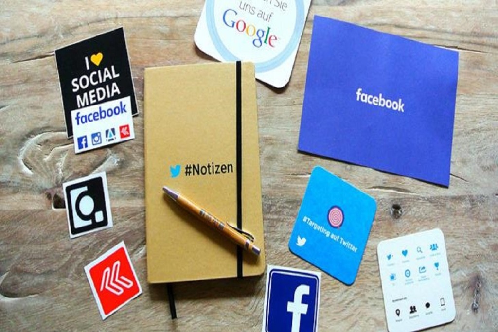 social media adverts on wooden table