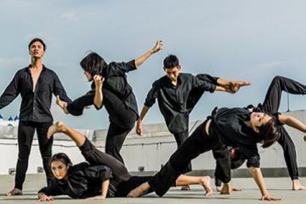 dancers in black in poses