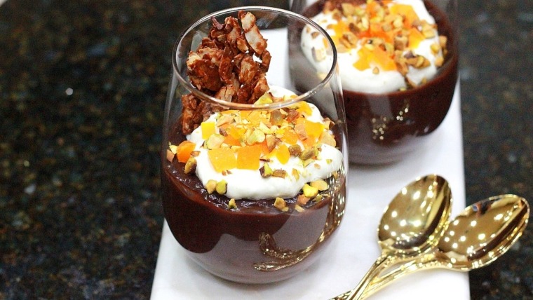 chocolate and coconut pudding in glass with silver spoons