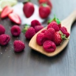 berries on wooden spoon