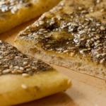 Zatar bread cut on wooden board