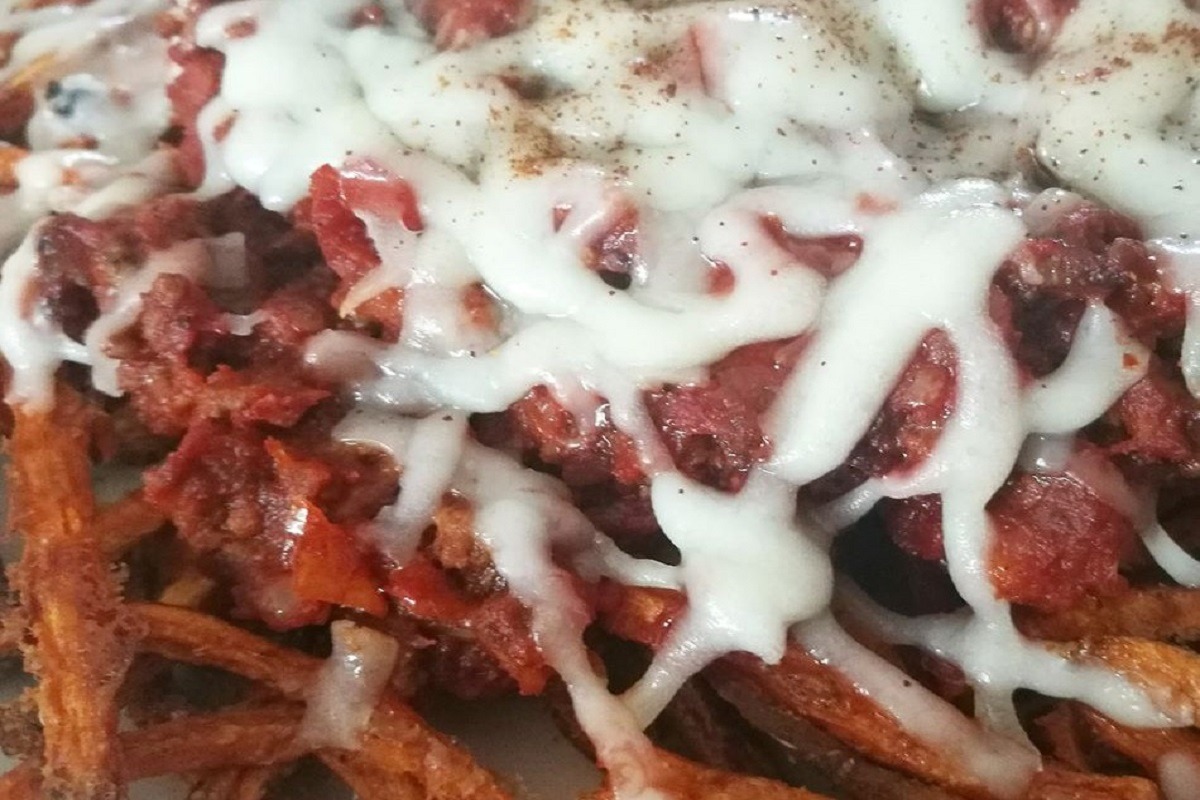 loaded fries with cheese melting