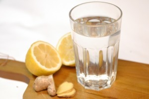 glass of water with lemon and ginger