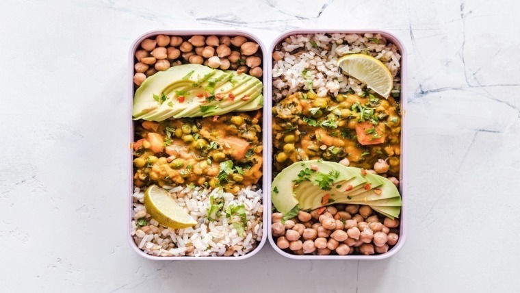 packed lunchbox with legumes and avocado