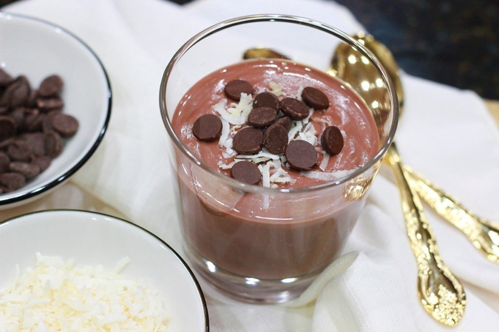 chocolate pudding in glass with gold spoon