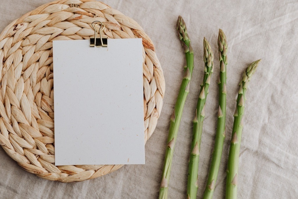 asparagus and writting pad with gold bulldog clip
