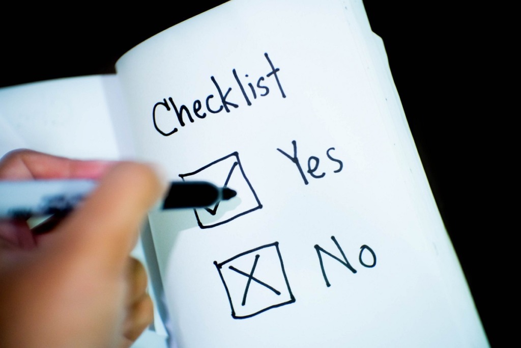 marking yes no checklist with felt marker