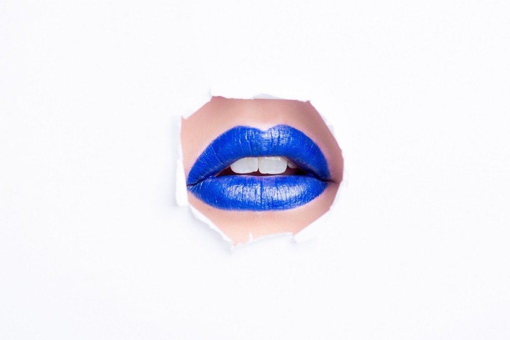 woman's lips painted blue