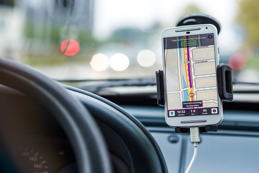 smart phone in holder on windscreen in car