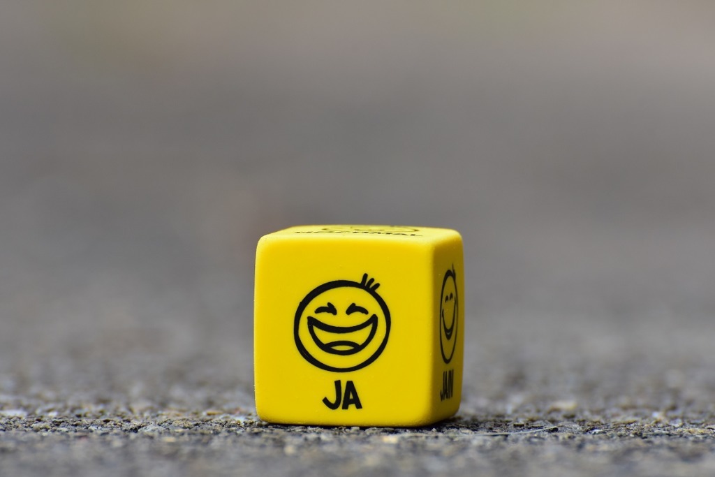 yellow cube with happy face upon it