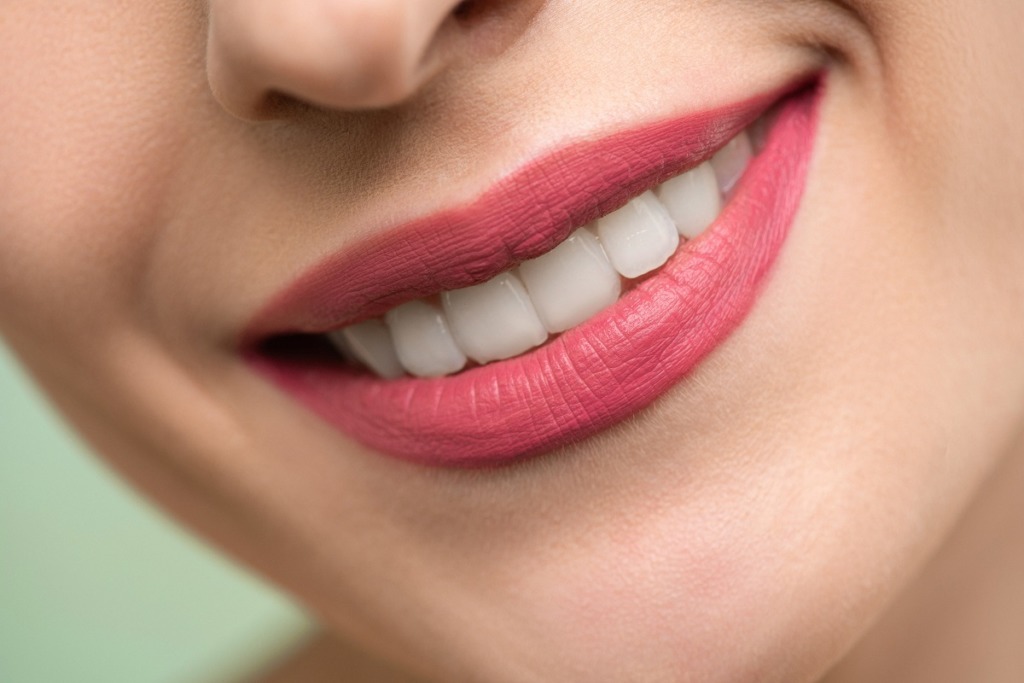 close up woman smiling with red lipstick