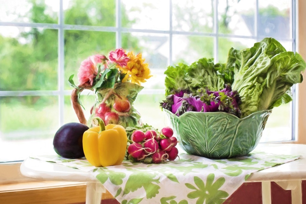 arrangement of vegetables on white table infront of window