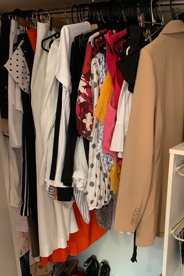 female cloths hanging in closet
