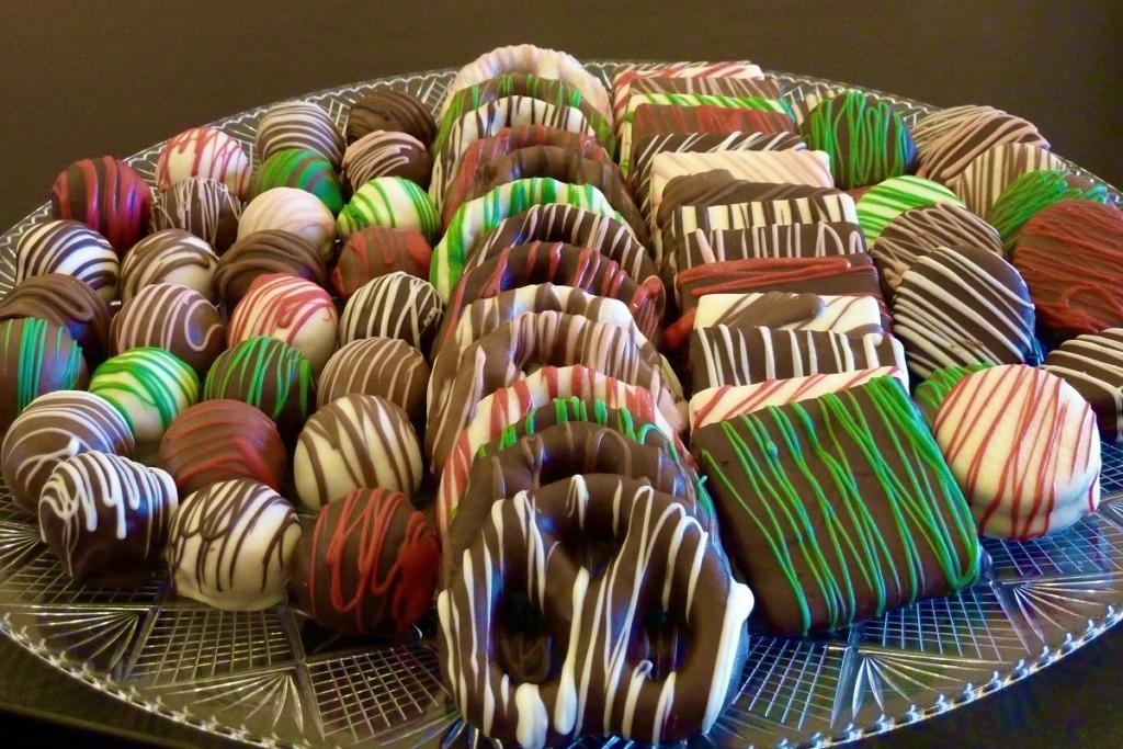a plate of colourful chocolates coated goodies